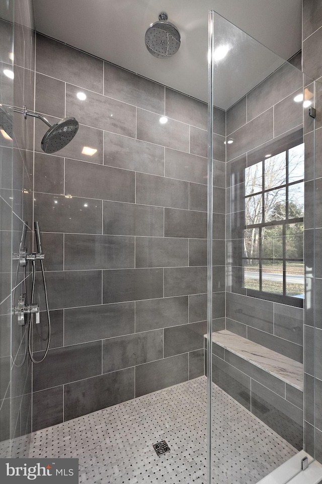 bathroom with tiled shower