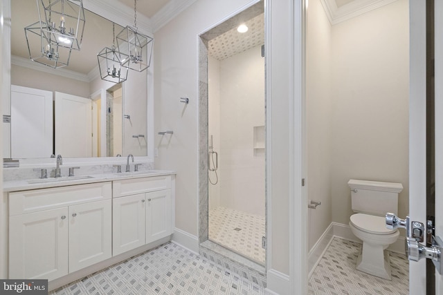 bathroom with crown molding, a shower with door, vanity, and toilet