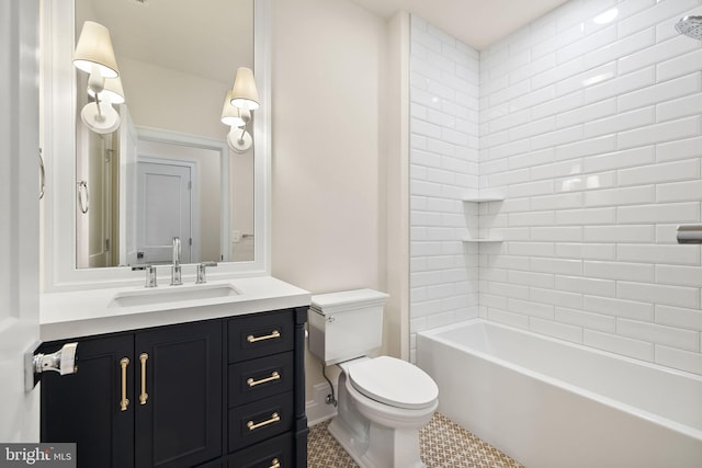 full bathroom featuring tile patterned flooring, vanity, tiled shower / bath combo, and toilet