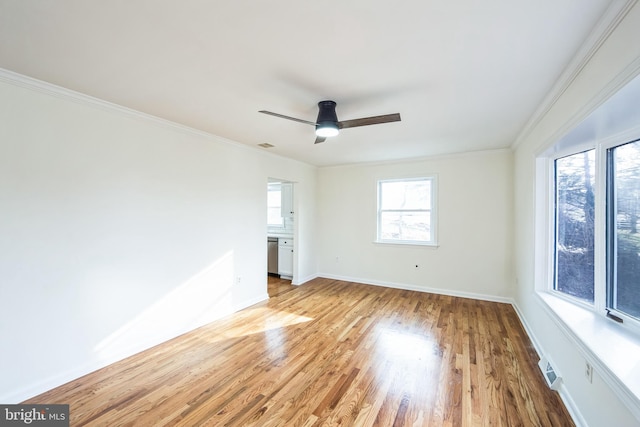 unfurnished room with crown molding, ceiling fan, and light wood-type flooring