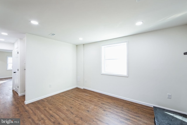 spare room featuring dark hardwood / wood-style flooring