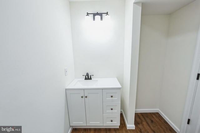 bathroom featuring hardwood / wood-style floors and vanity