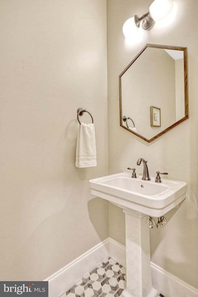 bathroom featuring sink and tile patterned flooring