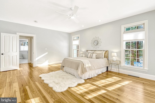 bedroom with ceiling fan and wood-type flooring