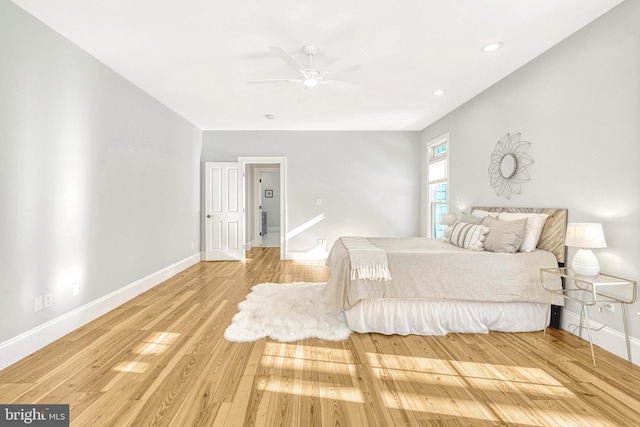 bedroom featuring ceiling fan and hardwood / wood-style flooring