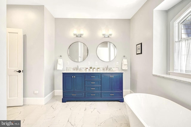 bathroom with vanity and a washtub