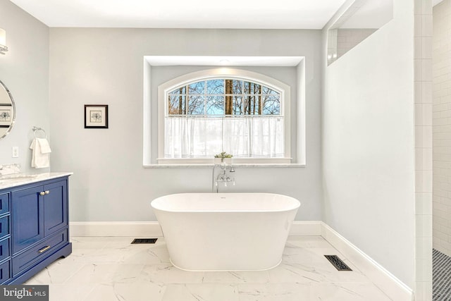 bathroom featuring shower with separate bathtub and vanity