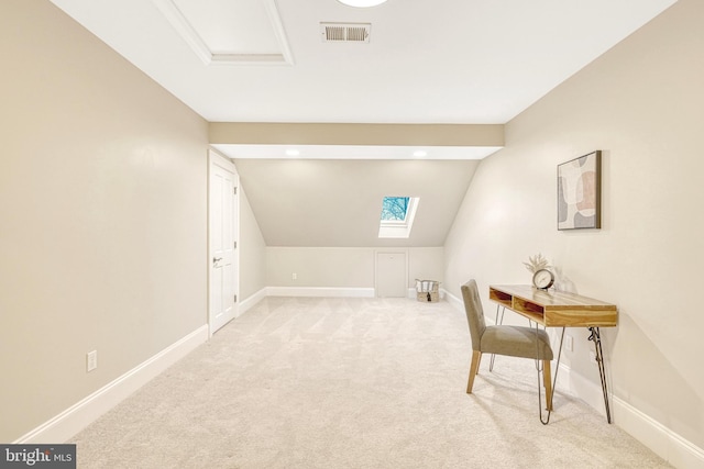 carpeted office with lofted ceiling