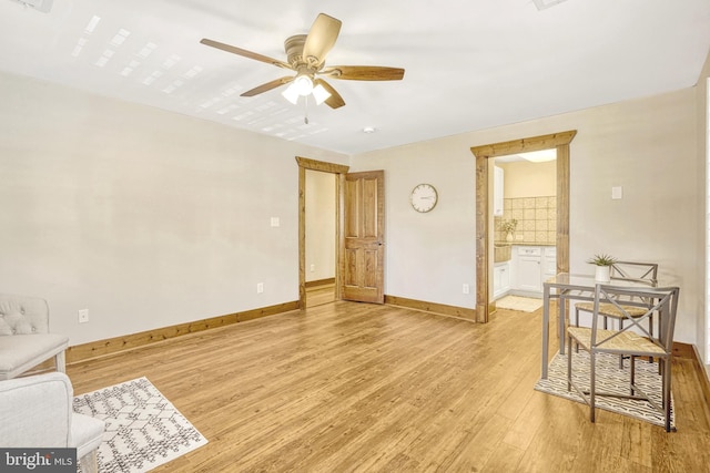 empty room featuring ceiling fan and light wood-type flooring