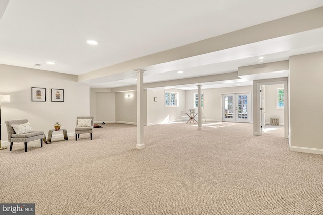 basement with french doors and light carpet