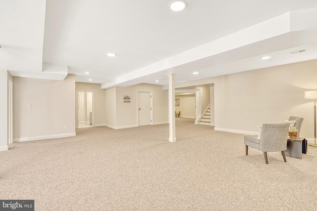 basement featuring light colored carpet