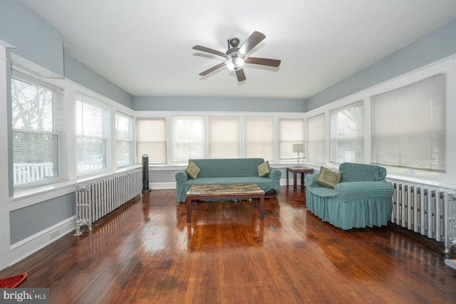 sunroom featuring radiator heating unit and ceiling fan