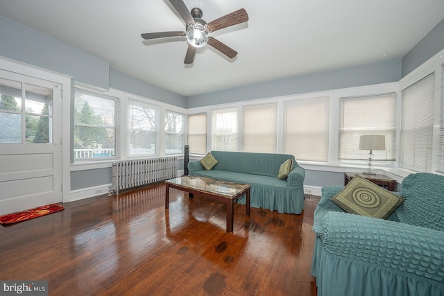 sunroom with radiator, ceiling fan, and plenty of natural light