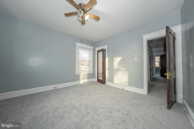 unfurnished bedroom featuring ceiling fan and carpet floors