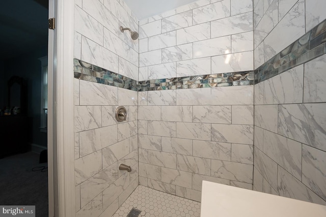 bathroom with tiled shower