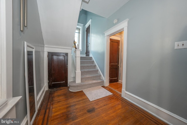 stairway featuring hardwood / wood-style flooring