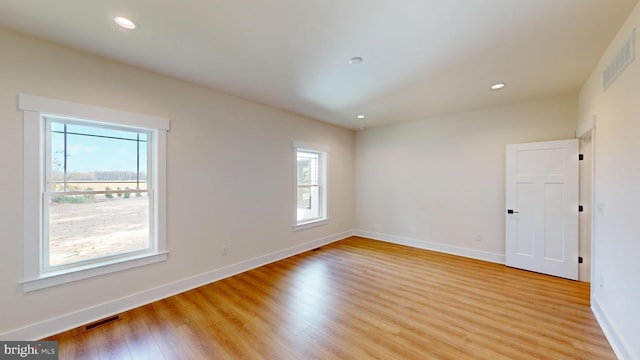 unfurnished room featuring light hardwood / wood-style flooring