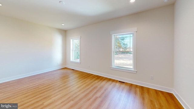 spare room with light hardwood / wood-style floors