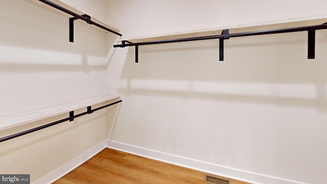 walk in closet featuring hardwood / wood-style floors