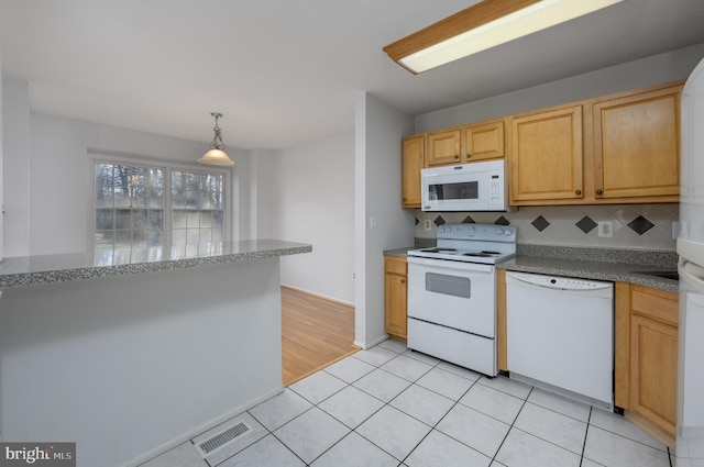 kitchen with decorative backsplash, light tile patterned floors, white appliances, and decorative light fixtures