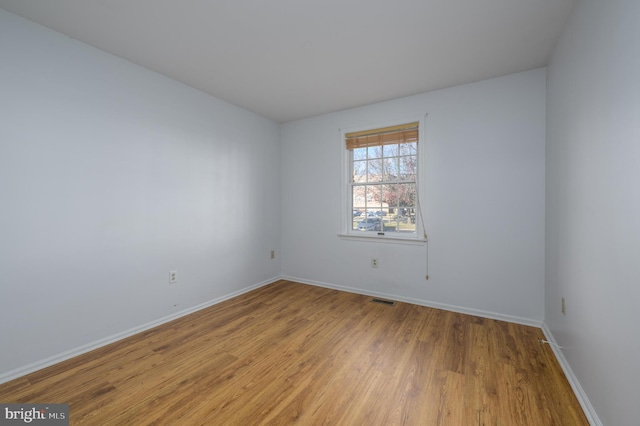 unfurnished room featuring light hardwood / wood-style floors