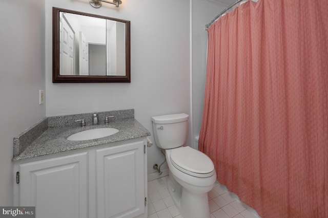 full bathroom featuring tile patterned floors, vanity, toilet, and shower / bath combo with shower curtain