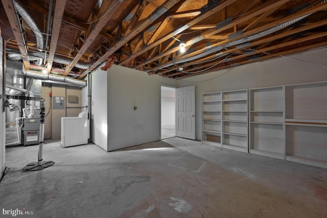 basement with washer / clothes dryer and heating unit