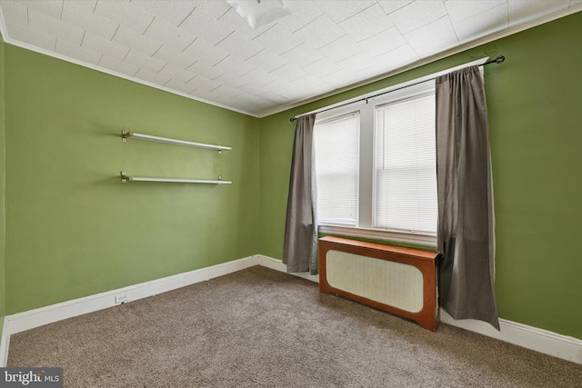 carpeted spare room with ornamental molding