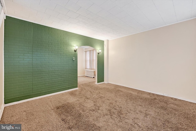 unfurnished room with carpet flooring