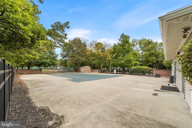 view of pool featuring a patio and central AC