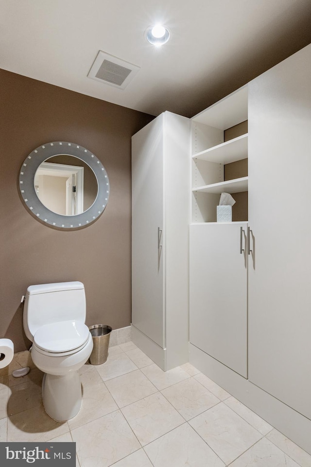 bathroom featuring tile patterned flooring and toilet