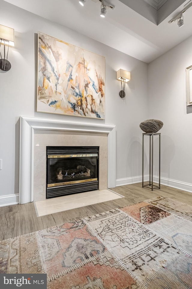 unfurnished living room with hardwood / wood-style flooring and a premium fireplace