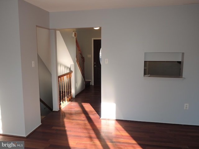 corridor with dark wood-type flooring