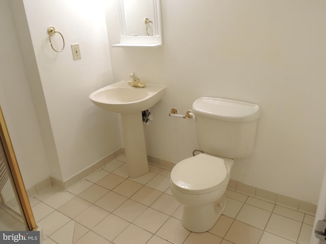 bathroom featuring tile patterned flooring and toilet