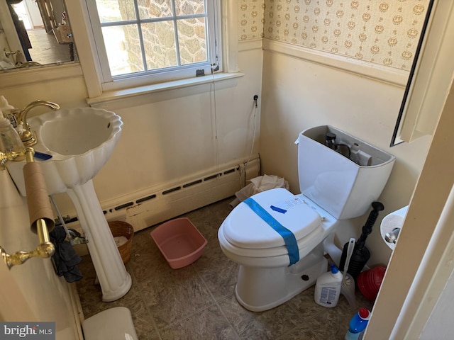 707 Wheatley Dr, Westminster, MD 21157 - bathroom featuring a baseboard radiator, toilet, wainscoting, and tile patterned flooring
