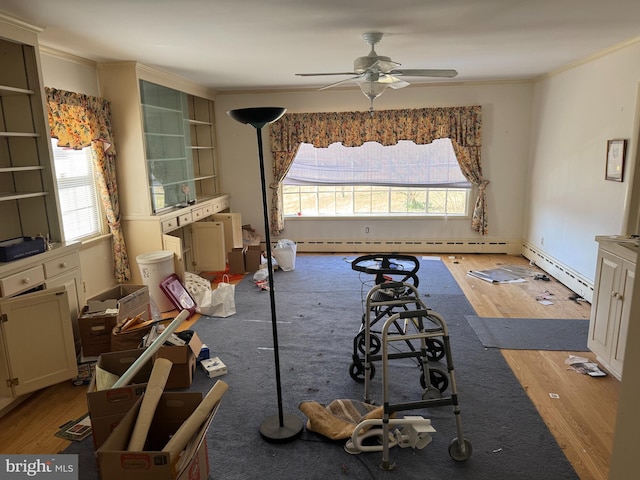 707 Wheatley Dr, Westminster, MD 21157 - unfurnished bedroom with crown molding, multiple windows, wood finished floors, and a baseboard radiator
