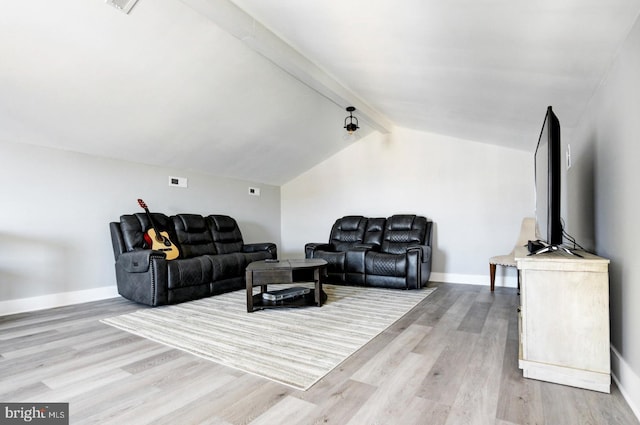 living room with lofted ceiling with beams and light hardwood / wood-style floors