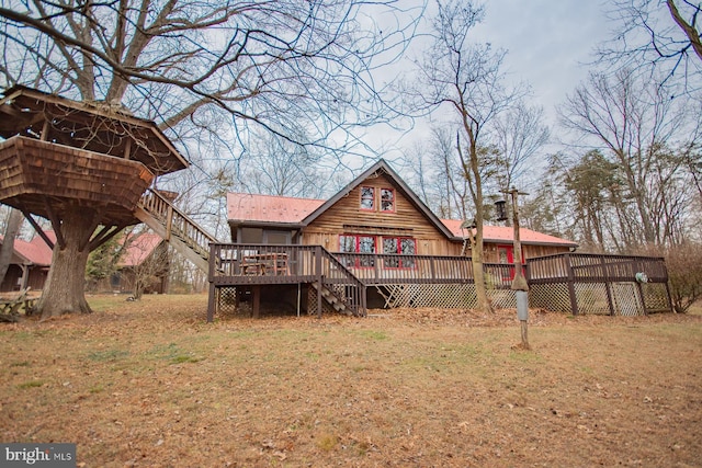 rear view of house with a wooden deck