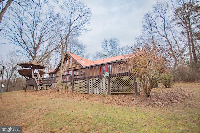 view of yard with a wooden deck