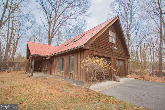 view of property exterior with a garage