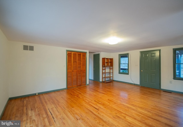 unfurnished living room with light hardwood / wood-style floors