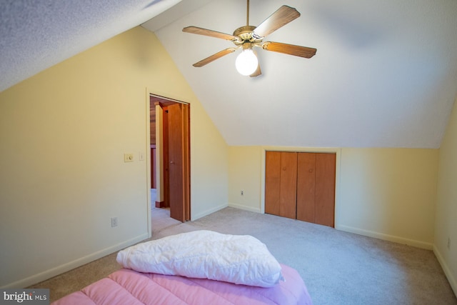 bonus room featuring ceiling fan, light colored carpet, and lofted ceiling