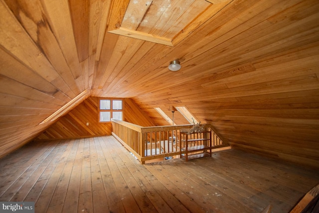 bonus room with hardwood / wood-style flooring, wood walls, wooden ceiling, and vaulted ceiling