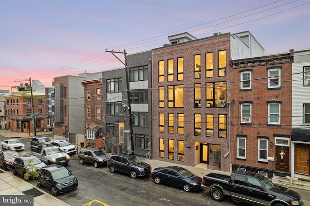 view of outdoor building at dusk