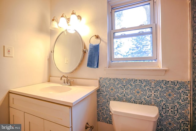 bathroom with vanity and toilet