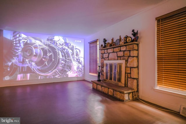 living room featuring a stone fireplace