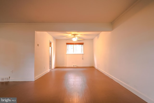 empty room with ceiling fan, hardwood / wood-style flooring, and ornamental molding