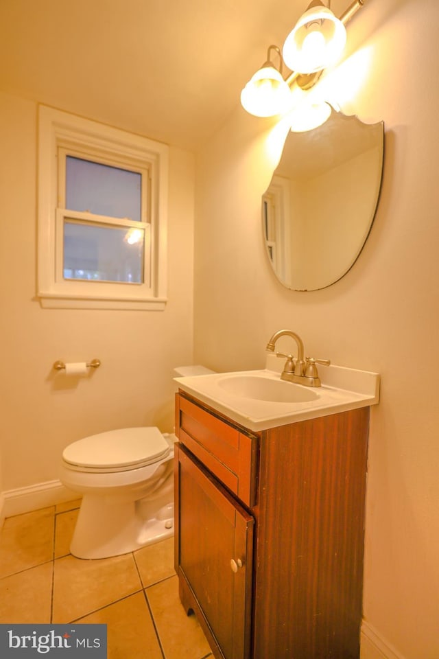 bathroom with tile patterned floors, vanity, and toilet