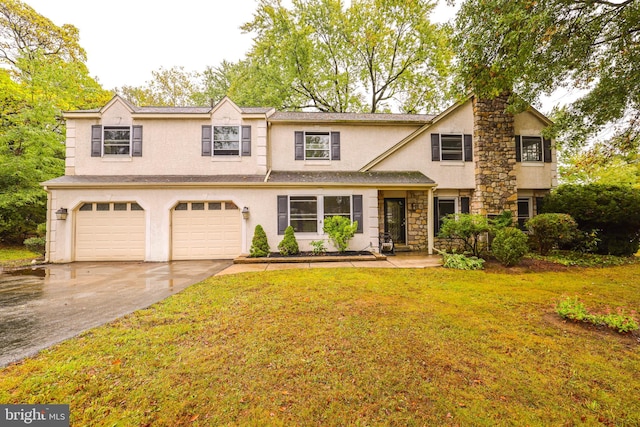 view of front of house with a front lawn and a garage