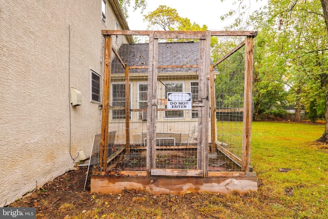 view of outdoor structure with a lawn